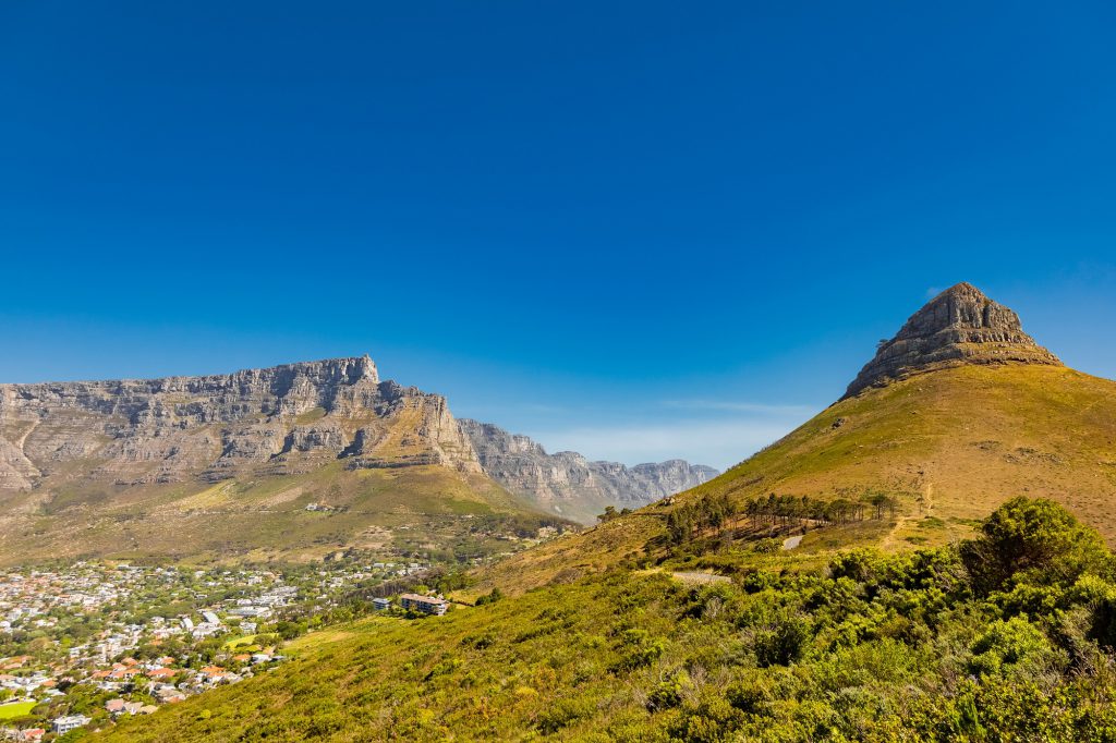 Urban cityscape with a rocky mountain range behind in Cape Town, South Africa